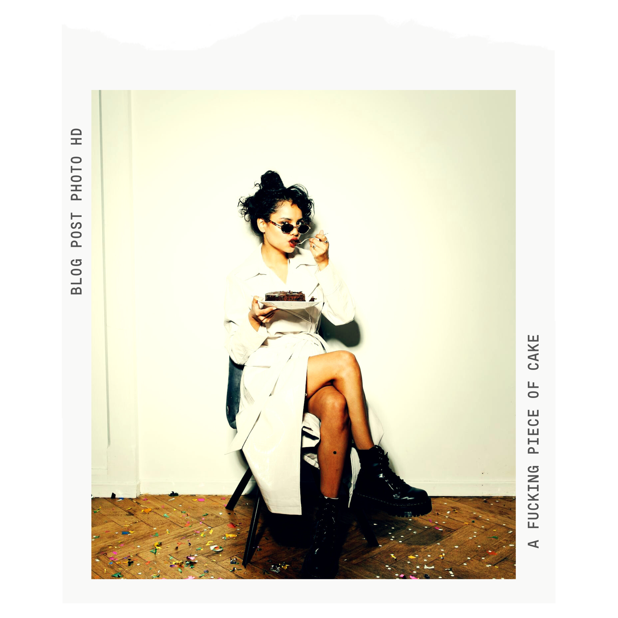 Old photo framme of a modern photo of a woman sitting on a chair in a white trench eating chocolate cake